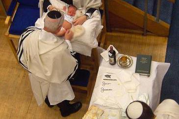 A Jewish circumcision being performed